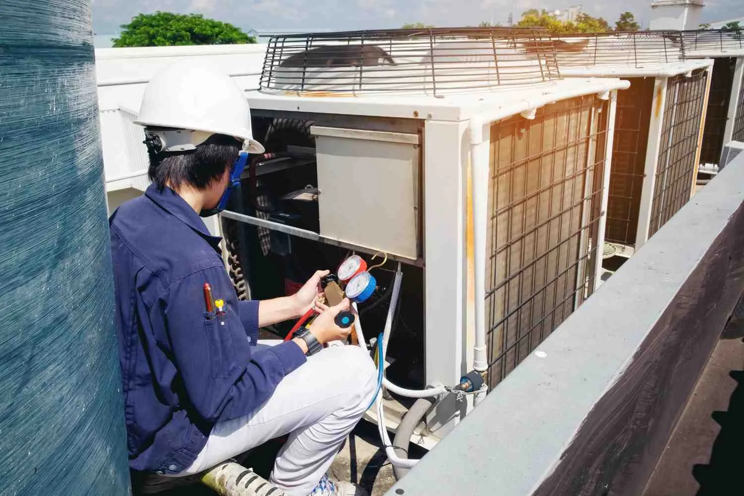 Technician servicing a heating and cooling unit